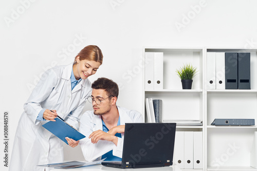 young couple working on laptop at home © SHOTPRIME STUDIO