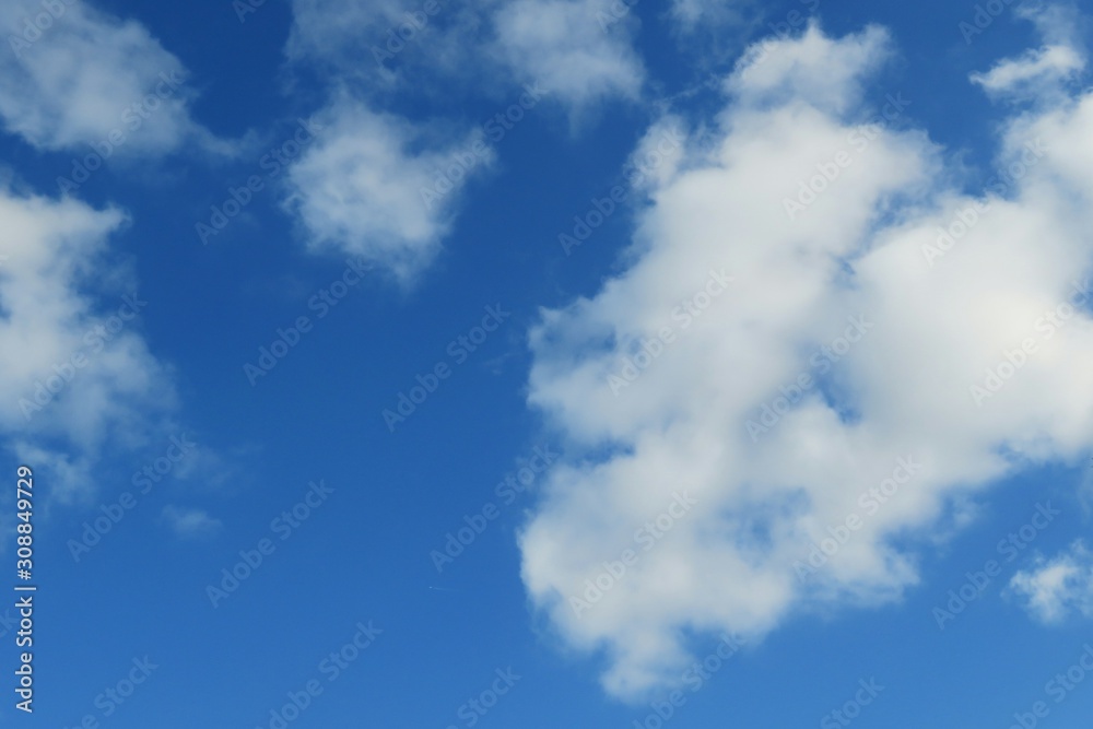 Blue sky with fluffy clouds, natural background Blue sky with fluffy clouds, natural background