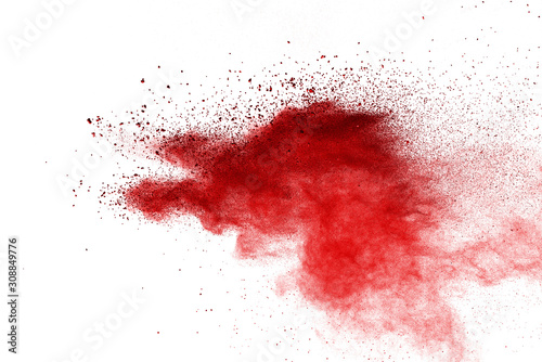 Red powder explosion on white background. Colored cloud. Colorful dust explode. Paint Holi.