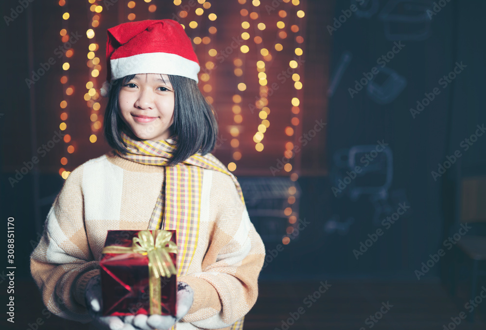 prety girl holding gift box in Christmas festival and happy new year