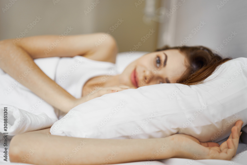 woman lying on bed woman lying on bed