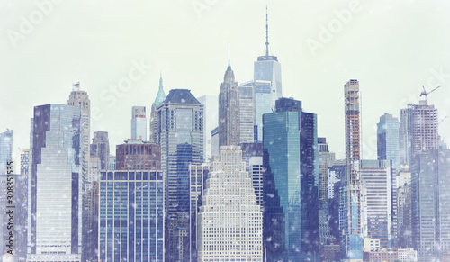 Toned photo New York City Manhattan downtown skyline at winter day during snowfall