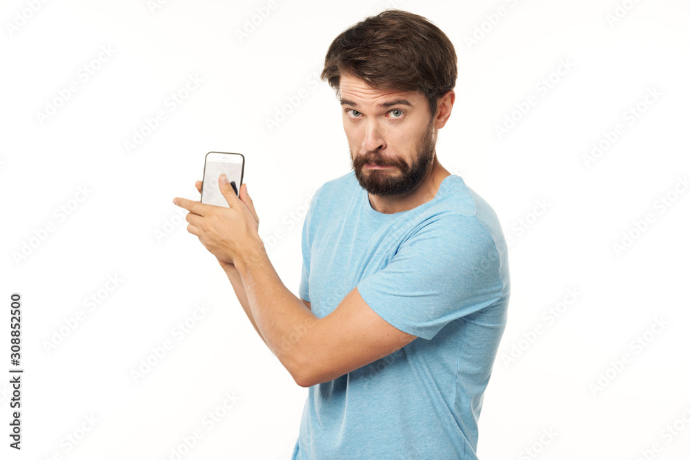young man texting on mobile phone young man texting on mobile phone