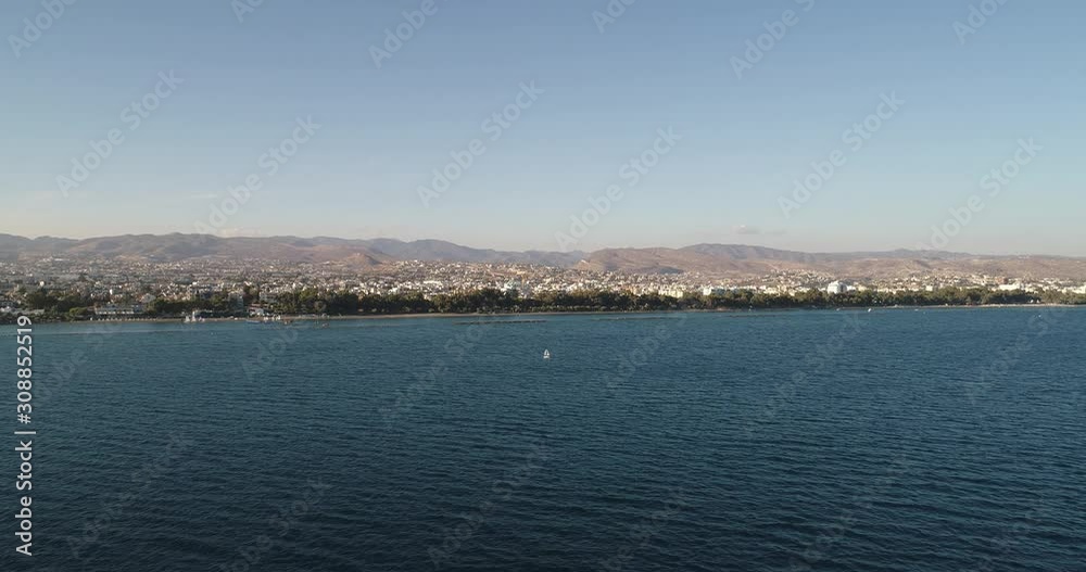Aerial view of the Mediterranean coast line and Limassol city center. Limassol seaside, yacht marina and water sport recreation. Drone view of the coastal city in a day time. Limassol, Cyprus. Aerial view of the Mediterranean coast line and Limassol city center. Limassol seaside, yacht marina and water sport recreation. Drone view of the coastal city in a day time. Limassol, Cyprus.
