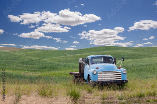 A vintage blue truck left in wheat fields in Palouse, Washington, USA