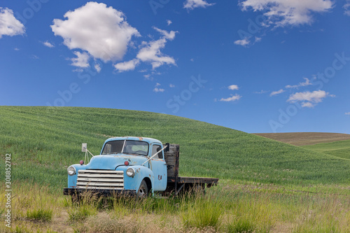 A vintage blue truck left in wheat fields in Palouse, Washington, USA