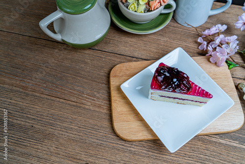 Blueburry cake on white ceramic plate photo