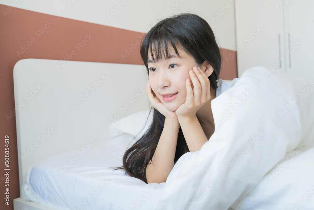 asian Young beautiful woman on bed at home, smile asian Young beautiful woman on bed at home, smile