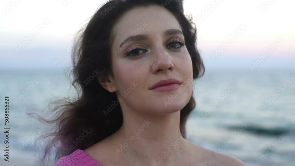 Portrait attractive girl with purple hair in a pink sweater by the sea, emotions. Portrait attractive girl with purple hair in a pink sweater by the sea, emotions.
