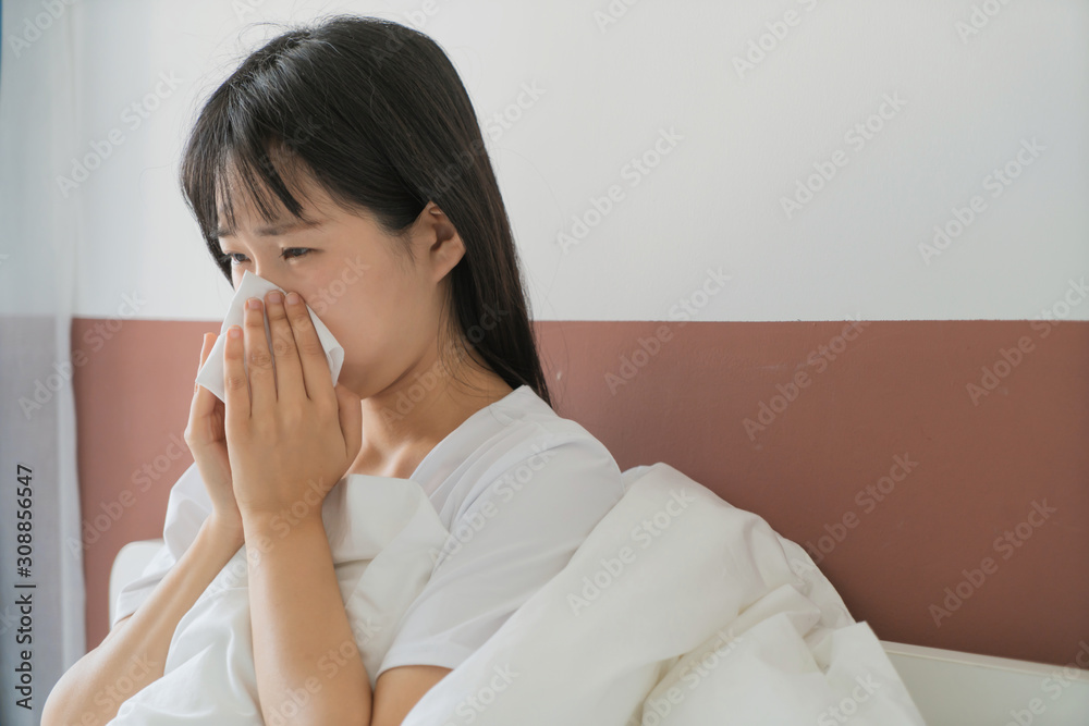 asian young woman get cold in bedroom, sneeze asian young woman get cold in bedroom, sneeze