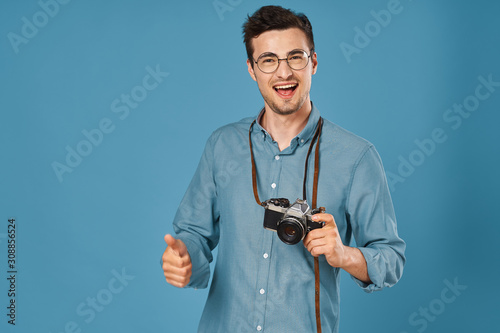 portrait of young man with camera