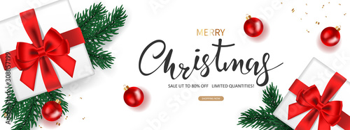 Christmas banner. Background Xmas decorated with Gifts box, Green Pine branches, and Christmas balls. Design sales promotion for holiday. Vector illustration.