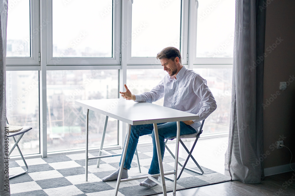 businessman sitting on chair and looking at camera businessman sitting on chair and looking at camera