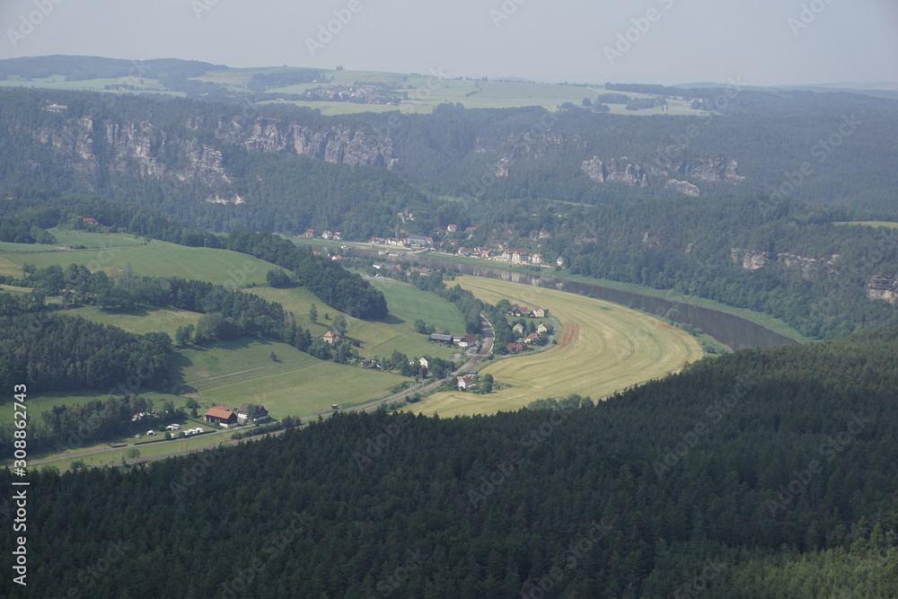Kurort Rathen from Lilienstein mountain with fields and Elbe river