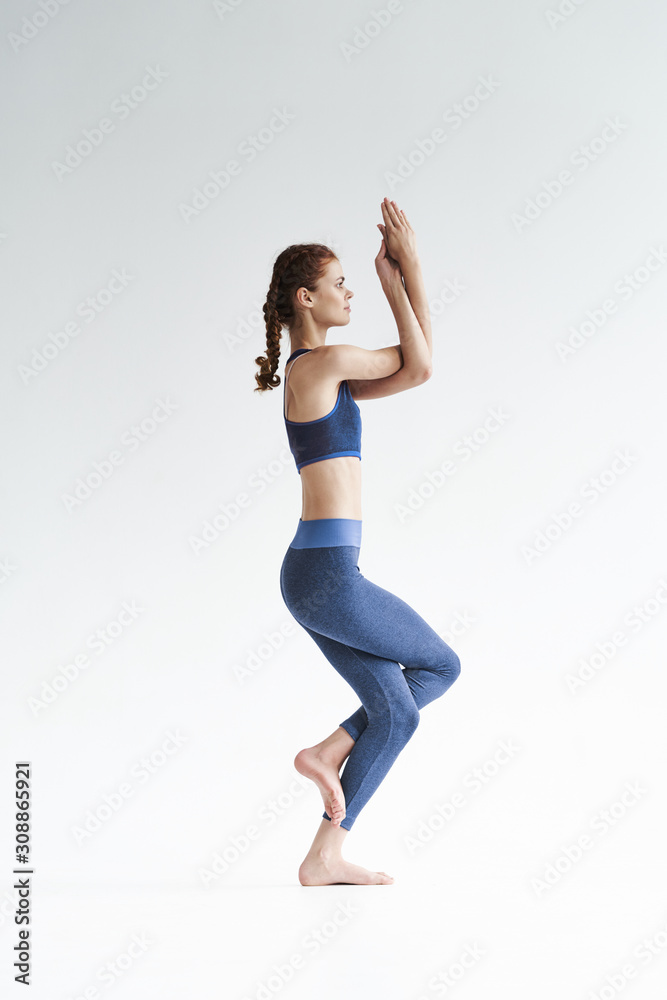 young woman doing yoga exercise