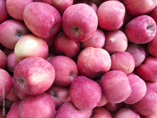 Fresh pink ripe apples as background