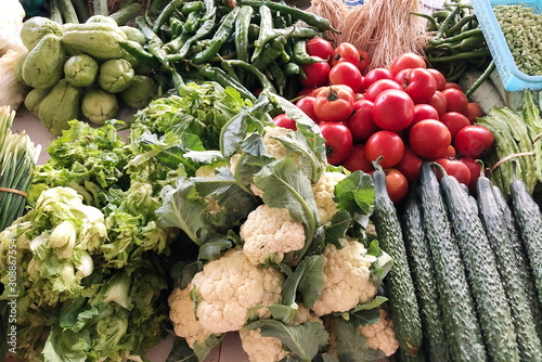 Organic green vegetables sold on market stall