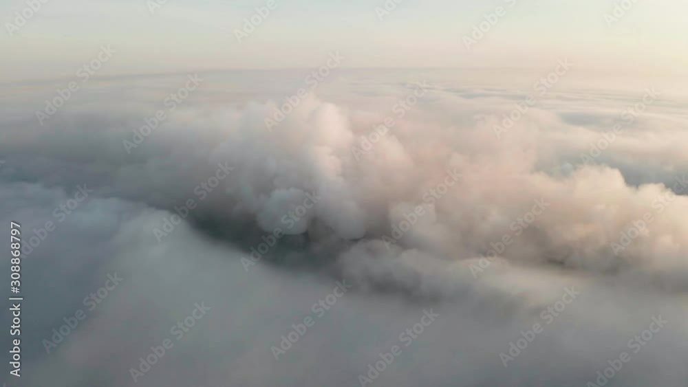 Flying over the evening clouds with the late sun.