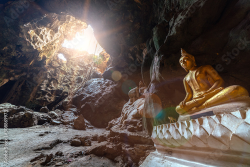 Buddha image with sun ray and lens flare