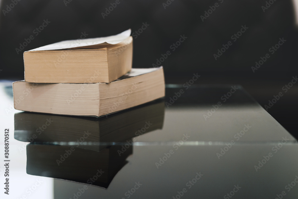 Stack of books on wooden table with copy space. Education background. Back to school concept - obrazy, fototapety, plakaty 