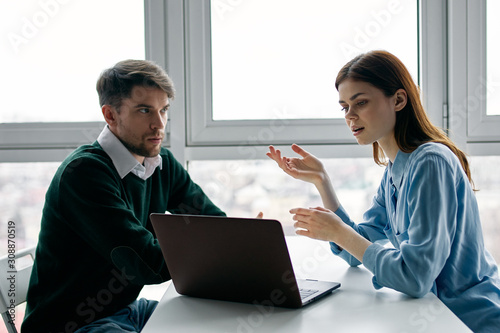businessman and businesswoman working in office