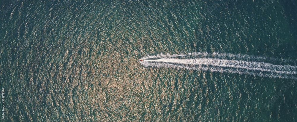 Aerial view of people having fun on jet ski, recreational summer holidays travel, water sport, freedom direction and outdoor adventure concept, drone above view - obrazy, fototapety, plakaty 