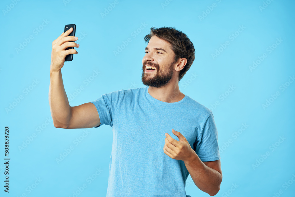 portrait of young man with mobile phone