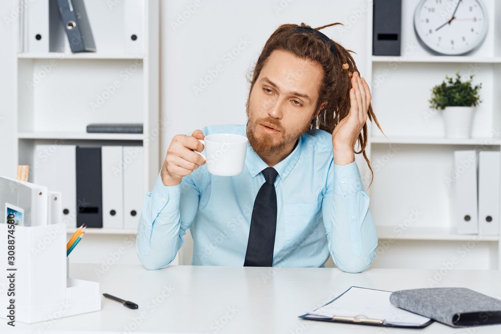 young businessman talking on phone in office