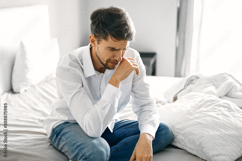 man sitting on sofa man sitting on sofa