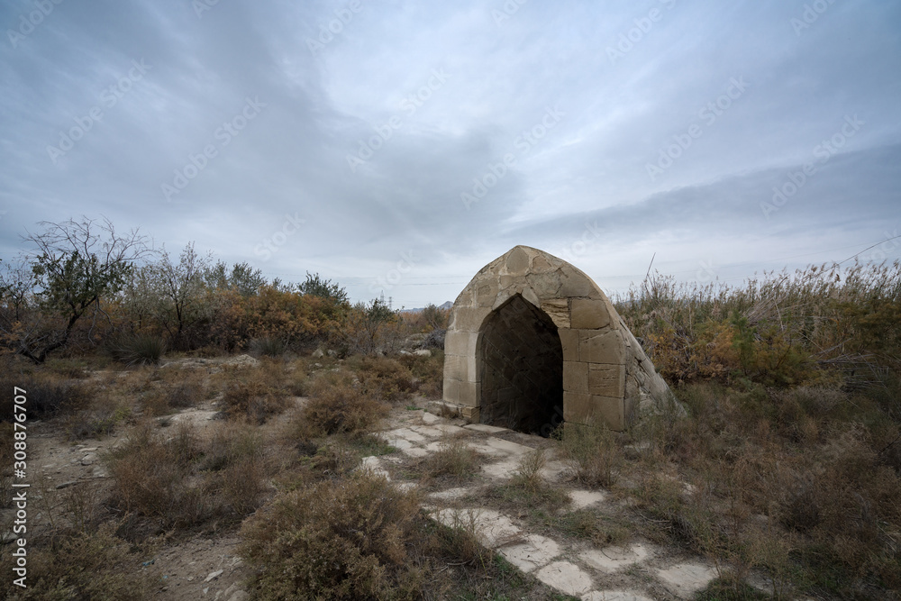 Old abandoned well in the courtyard of the caravanserai, located in Azerbaijan