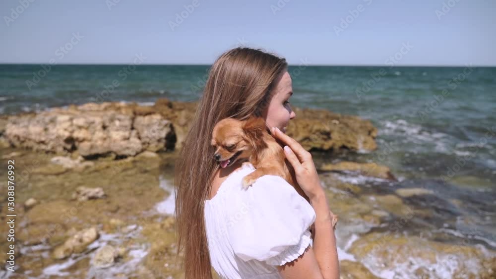Young adult girl spending time in travel together with dog Young adult girl spending time in travel together with dog