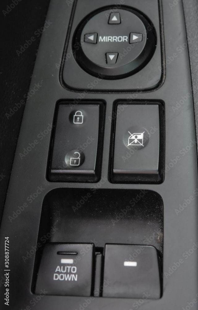 Side arm panel with buttons in a modern car Side arm panel with buttons in a modern car