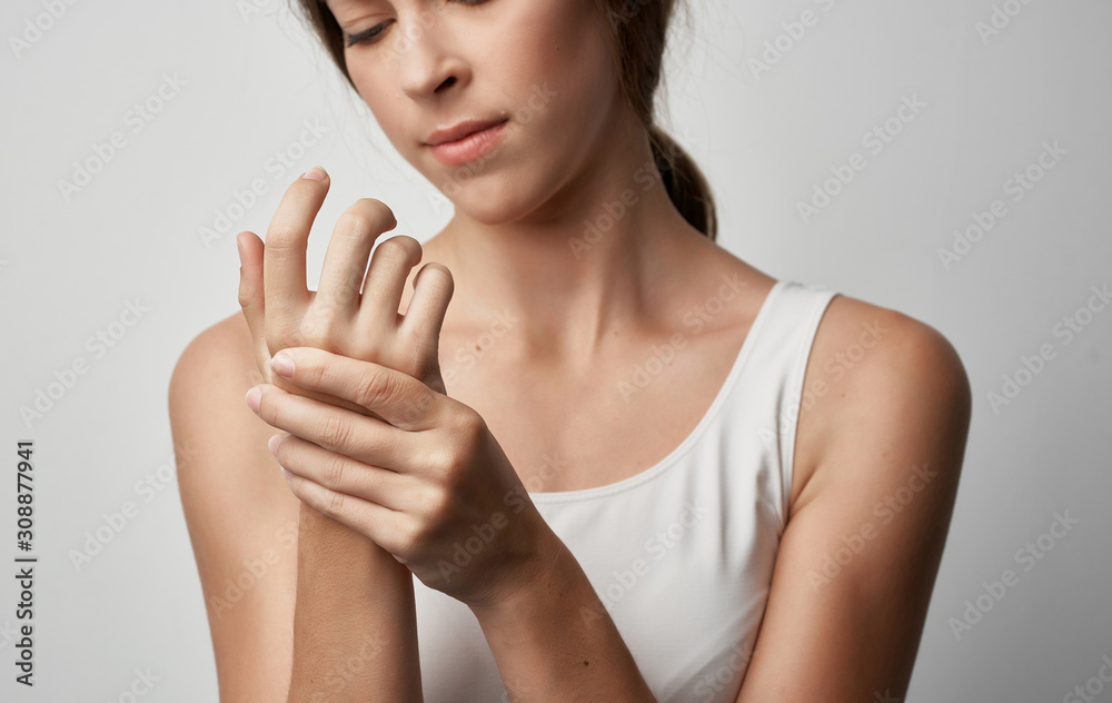 portrait of young woman with finger on her lips portrait of young woman with finger on her lips