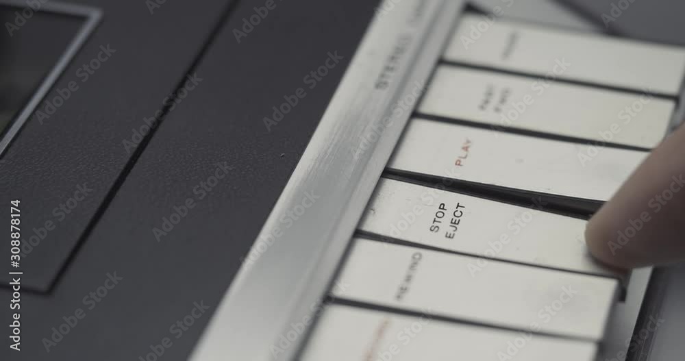 Stopping PLAY and EJECT button on retro audio cassette tape player