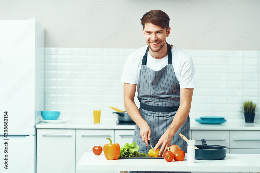 man cooking in kitchen man cooking in kitchen