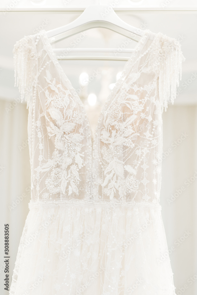 wedding dress hanging on the mirror, bride's morning wedding dress hanging on the mirror, bride's morning