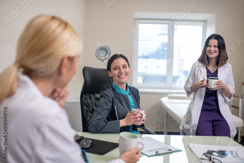 Three female doctors feeling good at work place photo