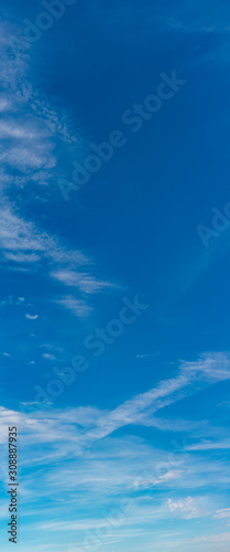 Fantastic soft clouds against blue sky, natural composition - panorama