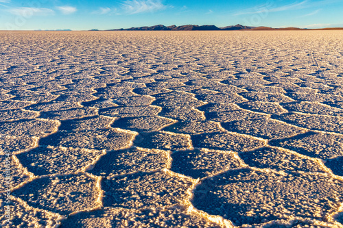 Salt pattern at sunset in the salar of Uyuni . Bolivia