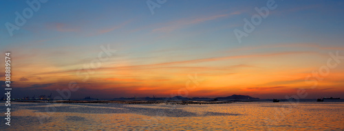 Panoramic view of dramatic twilight sky at sea with Si chang island background