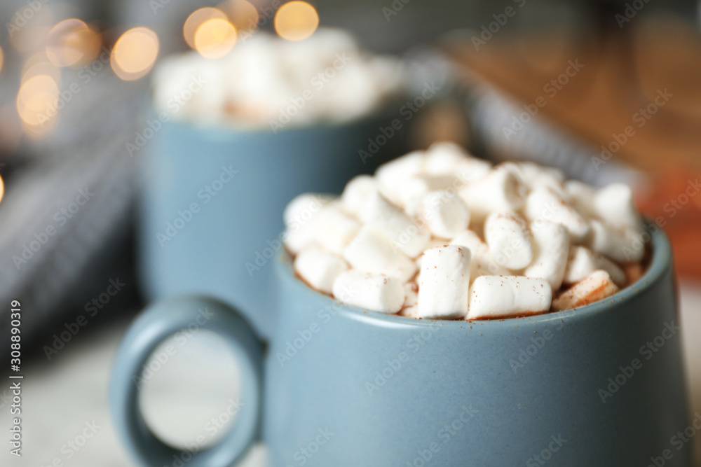 Delicious cocoa drink with marshmallows on table, closeup Delicious cocoa drink with marshmallows on table, closeup