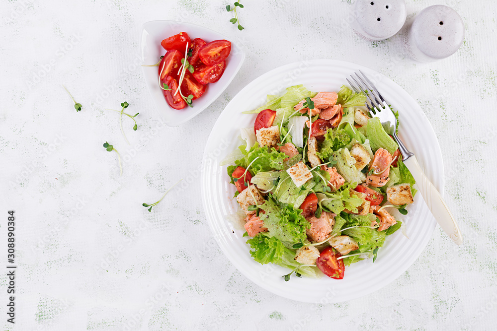 Caesar Salad with Salmon. Fish menu. Seafood - salmon. Top view, overhead, copy space