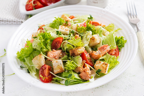Caesar Salad with Salmon. Fish menu. Seafood - salmon.