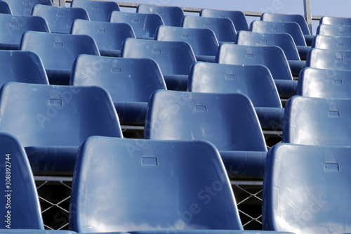 Stadium tribune. Plastic seats on the sport stadium