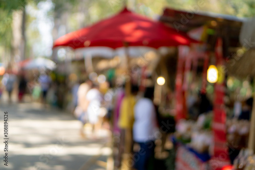 Abstract Blurred image of Chiangmai street market with bokeh for background usage.