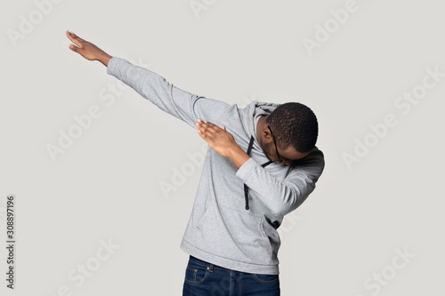 Bilde på lerret Happy young african american guy in sportswear making dab gesture