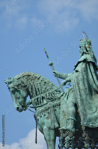 Bronze sculpture of a saint on a horse isolated  photo