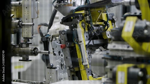 Wallpaper Mural Car engine assembly on the production line inside an automobile manufacturing plant Torontodigital.ca