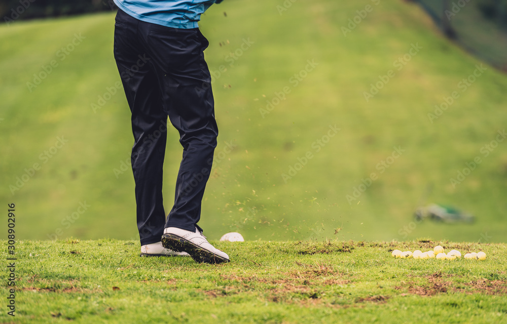 Golfer legs at golf tournament practice swing with driver. Golfer legs at golf tournament practice swing with driver.