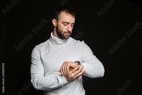 Portrait of young man looki...